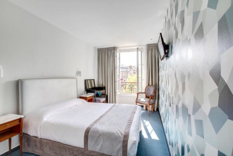 Rénovation d'une chambre d'hôtel avec revêtements du mur et du sol à Montparnasse